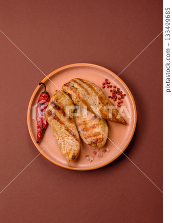 Grilled chicken or turkey breast, a healthy lunch option. Grilled chicken steak 133499685