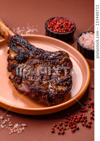 Grilled bone-in meat, beef tomahawk steak, juicy barbecued meat. Tomahawk steak 133499715