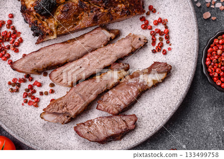 Grilled bone-in meat, beef tomahawk steak, juicy barbecued meat. Tomahawk steak Grilled bone-in meat, beef tomahawk steak, juicy barbecued meat. Tomahawk steak 133499758