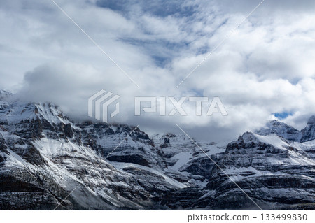 Impressive snow-capped mountains | Blue sky between the clouds | Telephoto photography 133499830