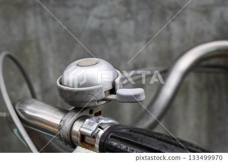 Retro metal bicycle bell, Vintage rusty bike bell on old bicycle ensures security in the road traffic for bikers and pedestrian. 133499970