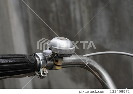 Retro metal bicycle bell, Vintage rusty bike bell on old bicycle ensures security in the road traffic for bikers and pedestrian. 133499971