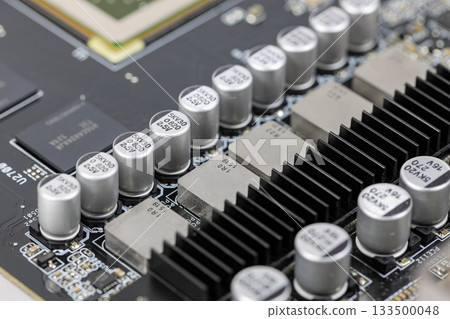 Solid-state capacitors on CPU power supply circuit of modern computer motherboard. 133500048