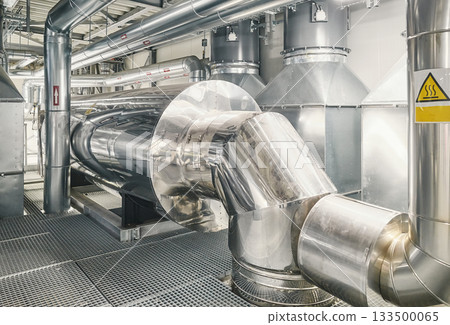 Heating and cooling pipe system with exhaust silencer in a heating plant. Heating and cooling pipe system with exhaust silencer in a heating plant. 133500065