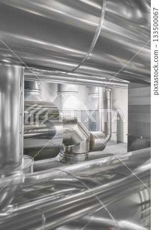 Heating and cooling pipe system with exhaust silencer in a heating plant. 133500067