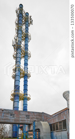 The chimney of a coal fired power plant supplying the district heating network. The chimney of a coal fired power plant supplying the district heating network. 133500070