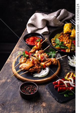 Assortment of grilled bbq meat and vegetables Assortment of grilled bbq meat and vegetables 133500124