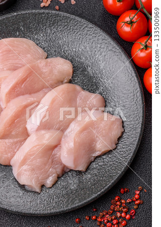 Slices of raw chicken or turkey breast, skinless and boneless. Chicken breast slices Slices of raw chicken or turkey breast, skinless and boneless. Chicken breast slices 133500969