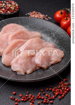 Slices of raw chicken or turkey breast, skinless and boneless. Chicken breast slices Slices of raw chicken or turkey breast, skinless and boneless. Chicken breast slices 133500970
