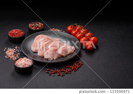 Slices of raw chicken or turkey breast, skinless and boneless. Chicken breast slices Slices of raw chicken or turkey breast, skinless and boneless. Chicken breast slices 133500971