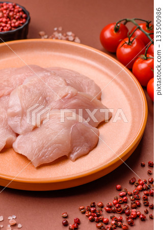 Slices of raw chicken or turkey breast, skinless and boneless. Chicken breast slices Slices of raw chicken or turkey breast, skinless and boneless. Chicken breast slices 133500986