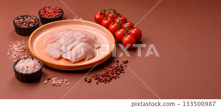 Slices of raw chicken or turkey breast, skinless and boneless. Chicken breast slices 133500987