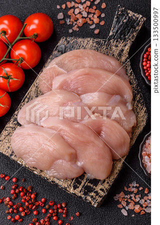 Slices of raw chicken or turkey breast, skinless and boneless. Chicken breast slices Slices of raw chicken or turkey breast, skinless and boneless. Chicken breast slices 133500997