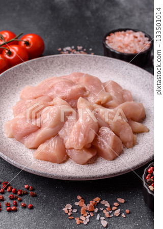 Strips of raw chicken or turkey fillet, skinless and boneless poultry breast. Chicken fillet strips Strips of raw chicken or turkey fillet, skinless and boneless poultry breast. Chicken fillet strips 133501014