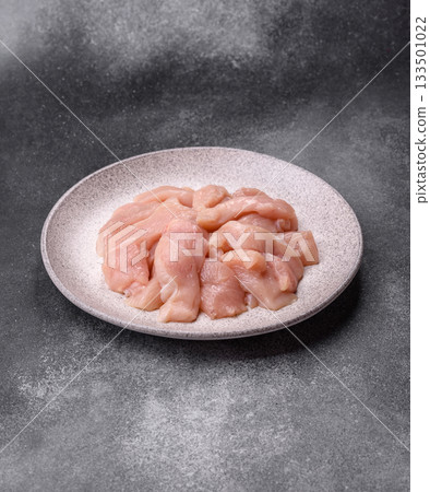 Strips of raw chicken or turkey fillet, skinless and boneless poultry breast. Chicken fillet strips 133501022