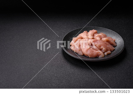 Strips of raw chicken or turkey fillet, skinless and boneless poultry breast. Chicken fillet strips Strips of raw chicken or turkey fillet, skinless and boneless poultry breast. Chicken fillet strips 133501023