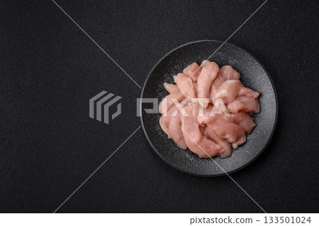 Strips of raw chicken or turkey fillet, skinless and boneless poultry breast. Chicken fillet strips 133501024
