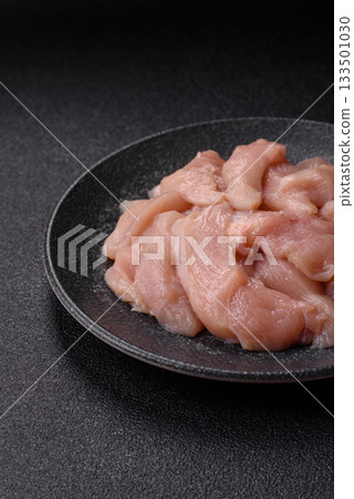 Strips of raw chicken or turkey fillet, skinless and boneless poultry breast. Chicken fillet strips 133501030