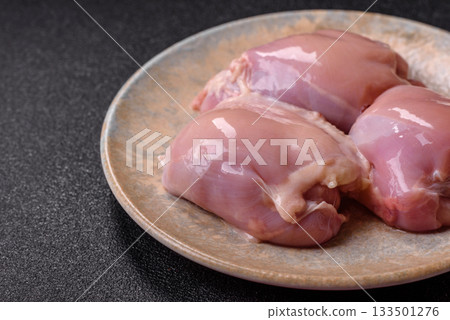 Raw chicken thigh fillet, poultry meat as a source of protein. Chicken thigh fillet 133501276