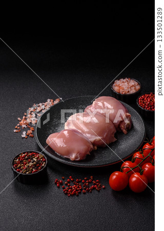 Raw chicken thigh fillet, poultry meat as a source of protein. Chicken thigh fillet Raw chicken thigh fillet, poultry meat as a source of protein. Chicken thigh fillet 133501289