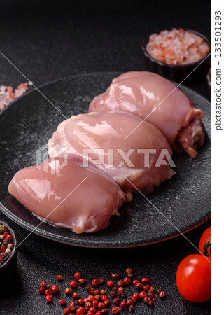Raw chicken thigh fillet, poultry meat as a source of protein. Chicken thigh fillet 133501293