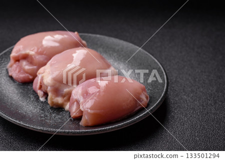 Raw chicken thigh fillet, poultry meat as a source of protein. Chicken thigh fillet Raw chicken thigh fillet, poultry meat as a source of protein. Chicken thigh fillet 133501294