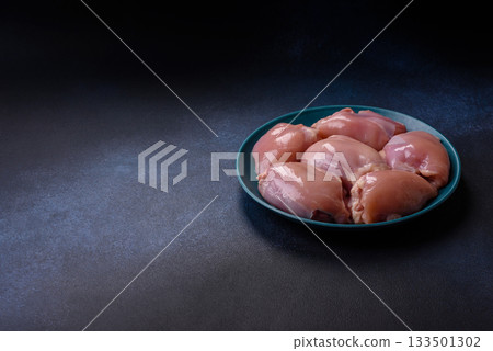 Raw chicken thigh fillet, poultry meat as a source of protein. Chicken thigh fillet 133501302