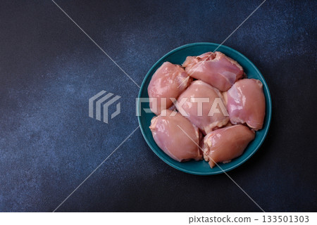 Raw chicken thigh fillet, poultry meat as a source of protein. Chicken thigh fillet Raw chicken thigh fillet, poultry meat as a source of protein. Chicken thigh fillet 133501303