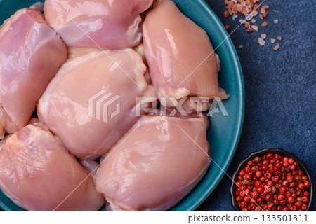 Raw chicken thigh fillet, poultry meat as a source of protein. Chicken thigh fillet 133501311