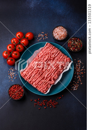 Raw ground beef or pork, prepared meat for burgers or other food preparation. Raw ground beef Raw ground beef or pork, prepared meat for burgers or other food preparation. Raw ground beef 133501319