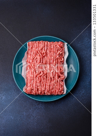 Raw ground beef or pork, prepared meat for burgers or other food preparation. Raw ground beef Raw ground beef or pork, prepared meat for burgers or other food preparation. Raw ground beef 133501331