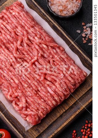 Raw ground beef or pork, prepared meat for burgers or other food preparation. Raw ground beef 133501345