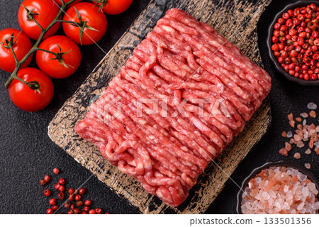 Raw ground beef or pork, prepared meat for burgers or other food preparation. Raw ground beef 133501356
