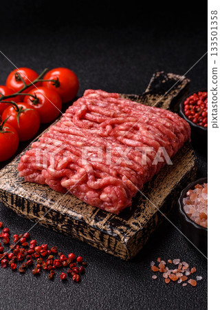 Raw ground beef or pork, prepared meat for burgers or other food preparation. Raw ground beef 133501358
