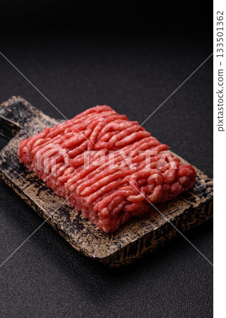 Raw ground beef or pork, prepared meat for burgers or other food preparation. Raw ground beef 133501362