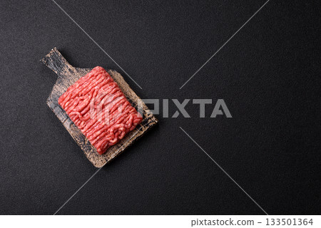 Raw ground beef or pork, prepared meat for burgers or other food preparation. Raw ground beef Raw ground beef or pork, prepared meat for burgers or other food preparation. Raw ground beef 133501364