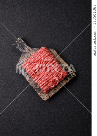 Raw ground beef or pork, prepared meat for burgers or other food preparation. Raw ground beef Raw ground beef or pork, prepared meat for burgers or other food preparation. Raw ground beef 133501365