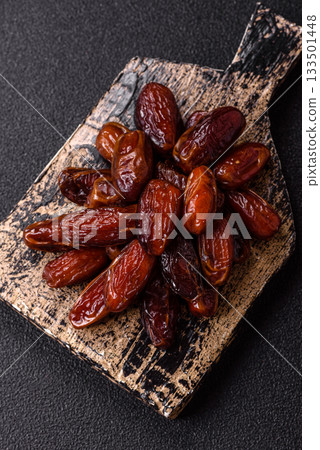 Dried dates in a ceramic plate, arabic food for the ramadan table. Dried dates as a food backgrounds 133501448