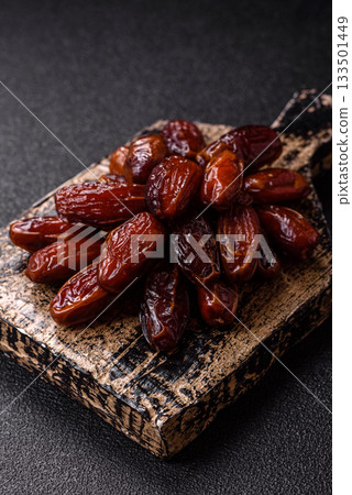 Dried dates in a ceramic plate, arabic food for the ramadan table. Dried dates as a food backgrounds 133501449