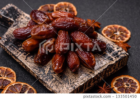 Dried dates in a ceramic plate, arabic food for the ramadan table. Dried dates as a food backgrounds Dried dates in a ceramic plate, arabic food for the ramadan table. Dried dates as a food backgrounds 133501450