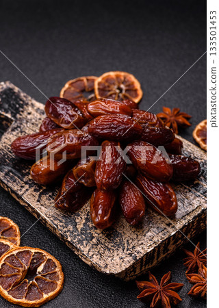 Dried dates in a ceramic plate, arabic food for the ramadan table. Dried dates as a food backgrounds Dried dates in a ceramic plate, arabic food for the ramadan table. Dried dates as a food backgrounds 133501453