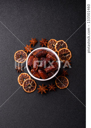 Dried dates in a ceramic plate, arabic food for the ramadan table. Dried dates as a food backgrounds 133501460