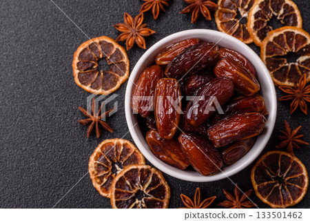 Dried dates in a ceramic plate, arabic food for the ramadan table. Dried dates as a food backgrounds Dried dates in a ceramic plate, arabic food for the ramadan table. Dried dates as a food backgrounds 133501462
