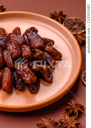 Dried dates in a ceramic plate, arabic food for the ramadan table. Dried dates as a food backgrounds 133501485