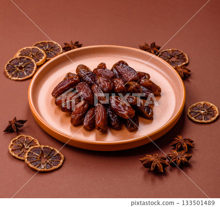 Dried dates in a ceramic plate, arabic food for the ramadan table. Dried dates as a food backgrounds 133501489