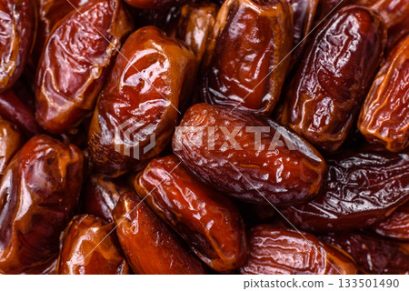Dried dates in a ceramic plate, arabic food for the ramadan table. Dried dates as a food backgrounds Dried dates in a ceramic plate, arabic food for the ramadan table. Dried dates as a food backgrounds 133501490