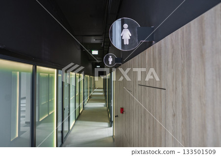 Long Hallway With Toilet Sign Long Hallway With Toilet Sign 133501509