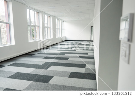 Empty office space With Checkered Floor and Windows 133501512