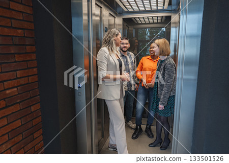 Group of People Standing in an Elevator 133501526