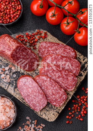 Sliced salami sausage, smoked meat as a delicacy for the table. Salami sausage 133501673